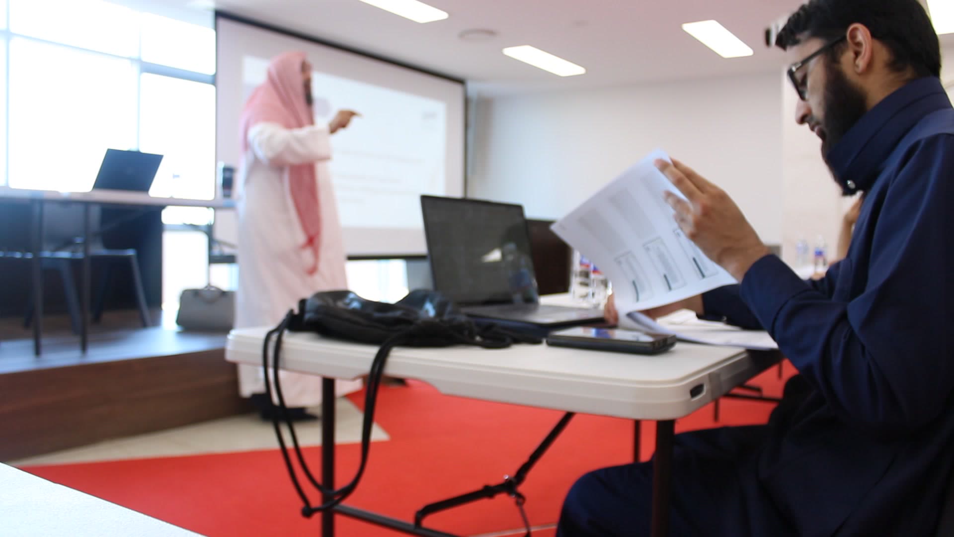 A Shurayh student following the text on a laptop